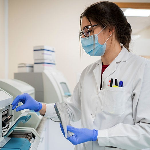 Female medical provider wearing a mask