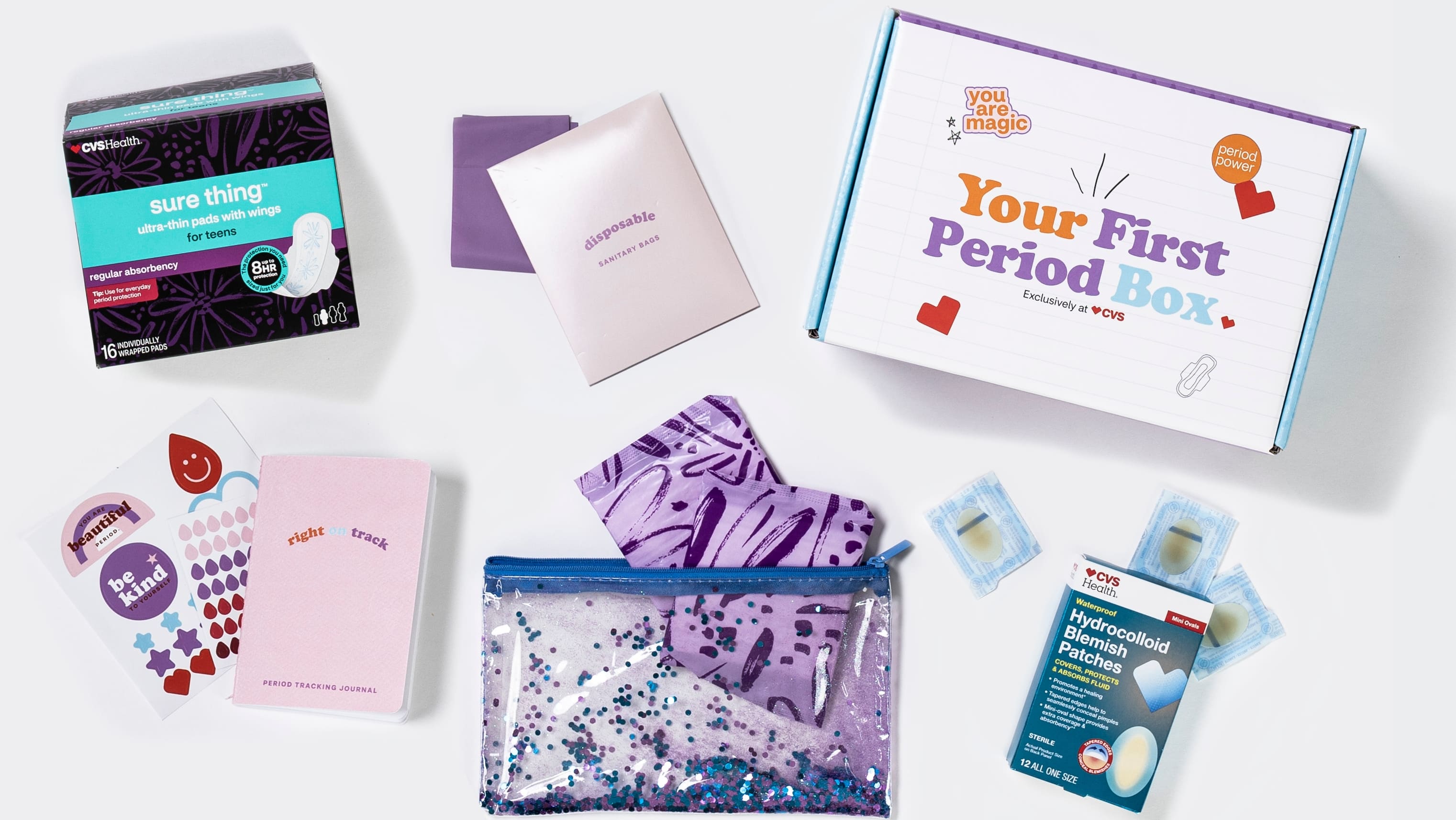 First period box and some content including stickers, period products, information, calendar and more.