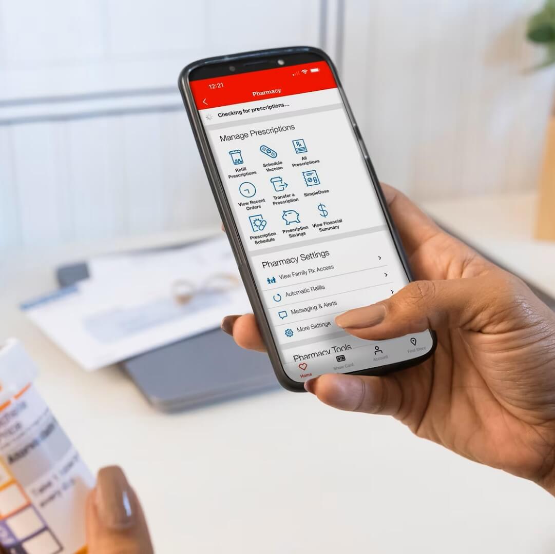 Someone using the CVS app to get information on prescriptions